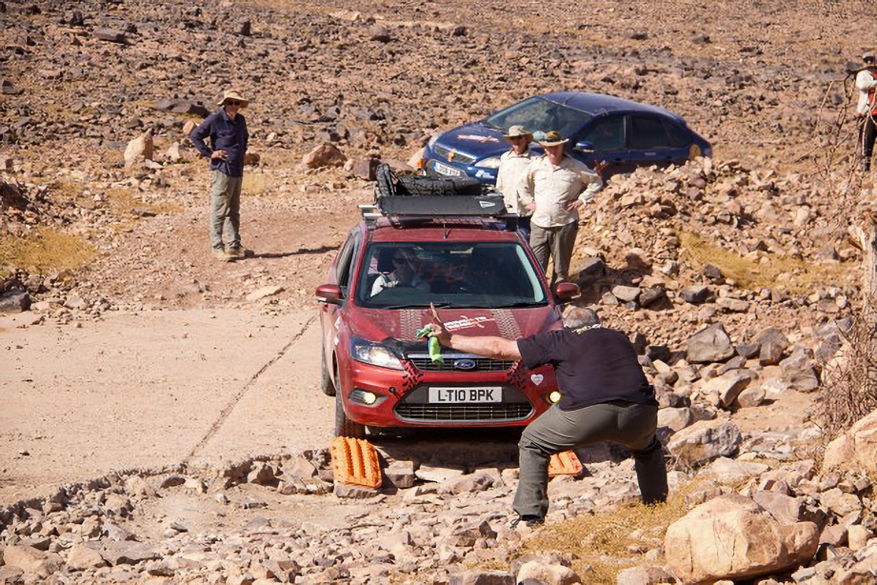 Slow progress as the cars take on the 'dinosaur's footprint' 